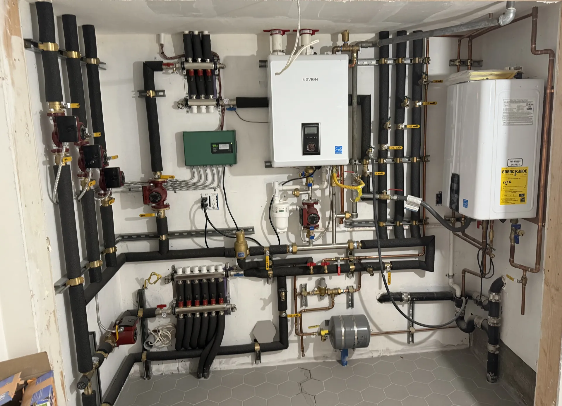 Tankless water heater and storage tank plumbed with copper pipe